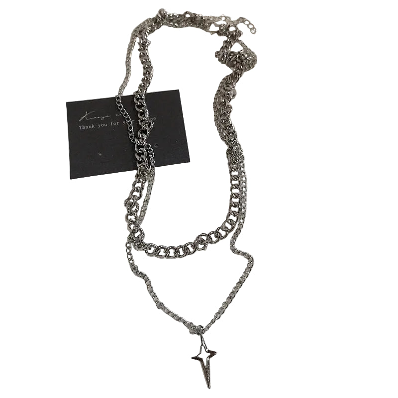 Layered chain necklace with a star pendant on a white background