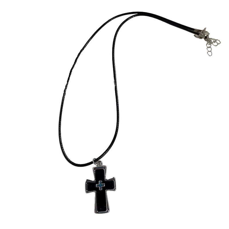 Black cross pendant necklace on a white background