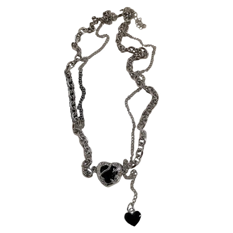 Silver chain necklace with black heart pendants on a white background