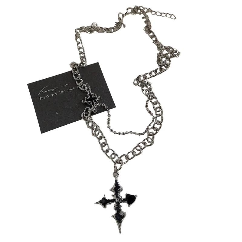 Necklace with a black cross pendant on a white background