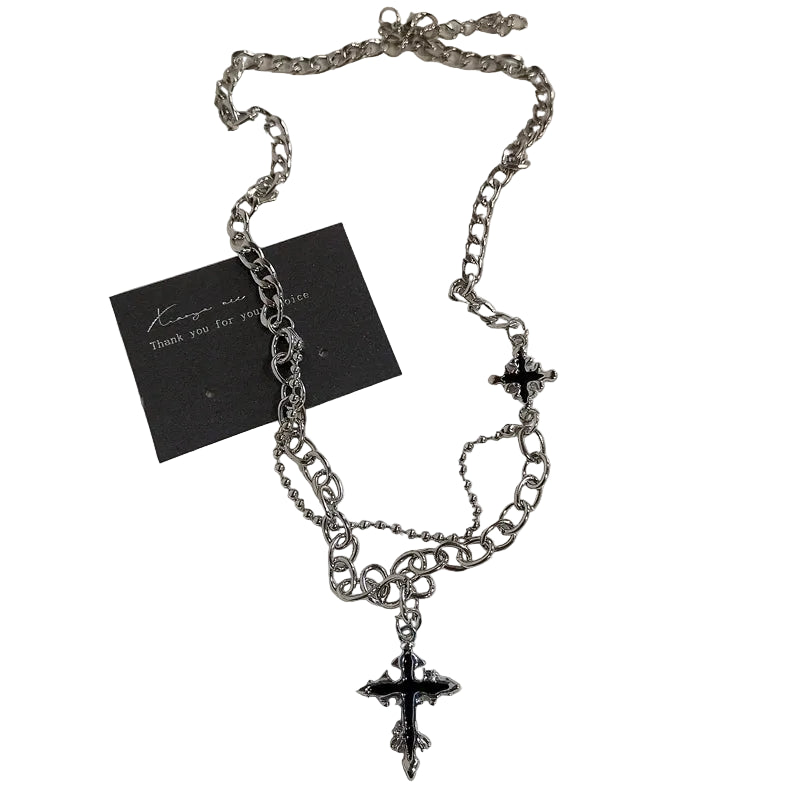 Silver chain necklace with cross pendant on a white background